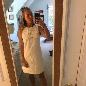 Clean white dress with gold metal detailing